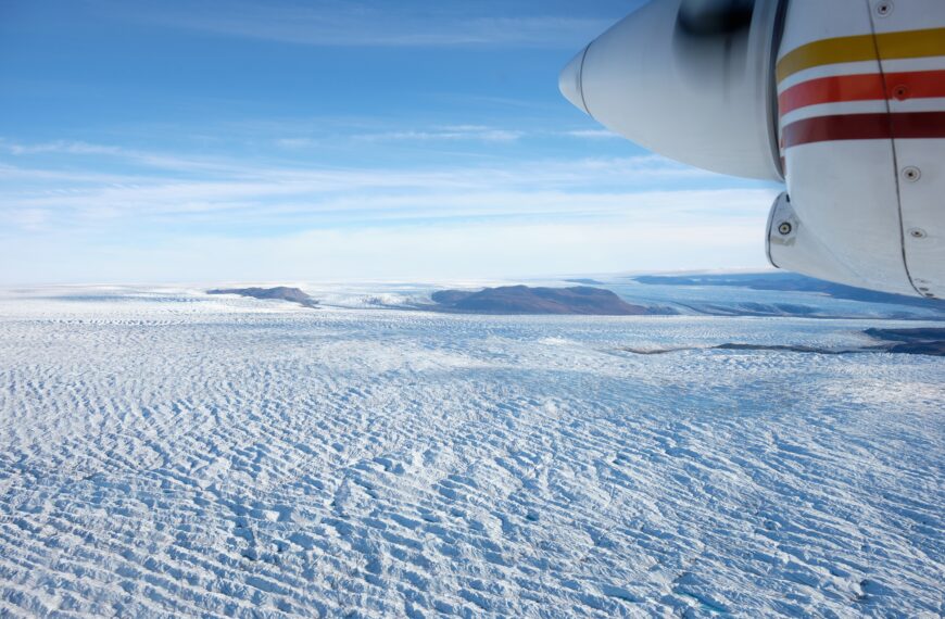 Scenic flight near Kangerlussuaq with a view of the Greenland Ice Sheet and engine of plane - West Greenland