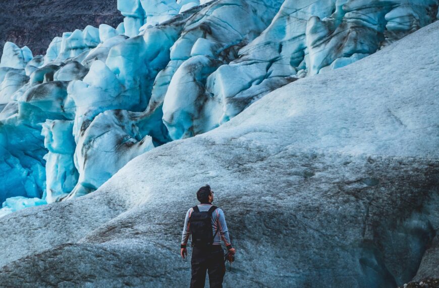Photographer standing in front of a glacier face in Maniitsup Sermilia near Maniitsoq