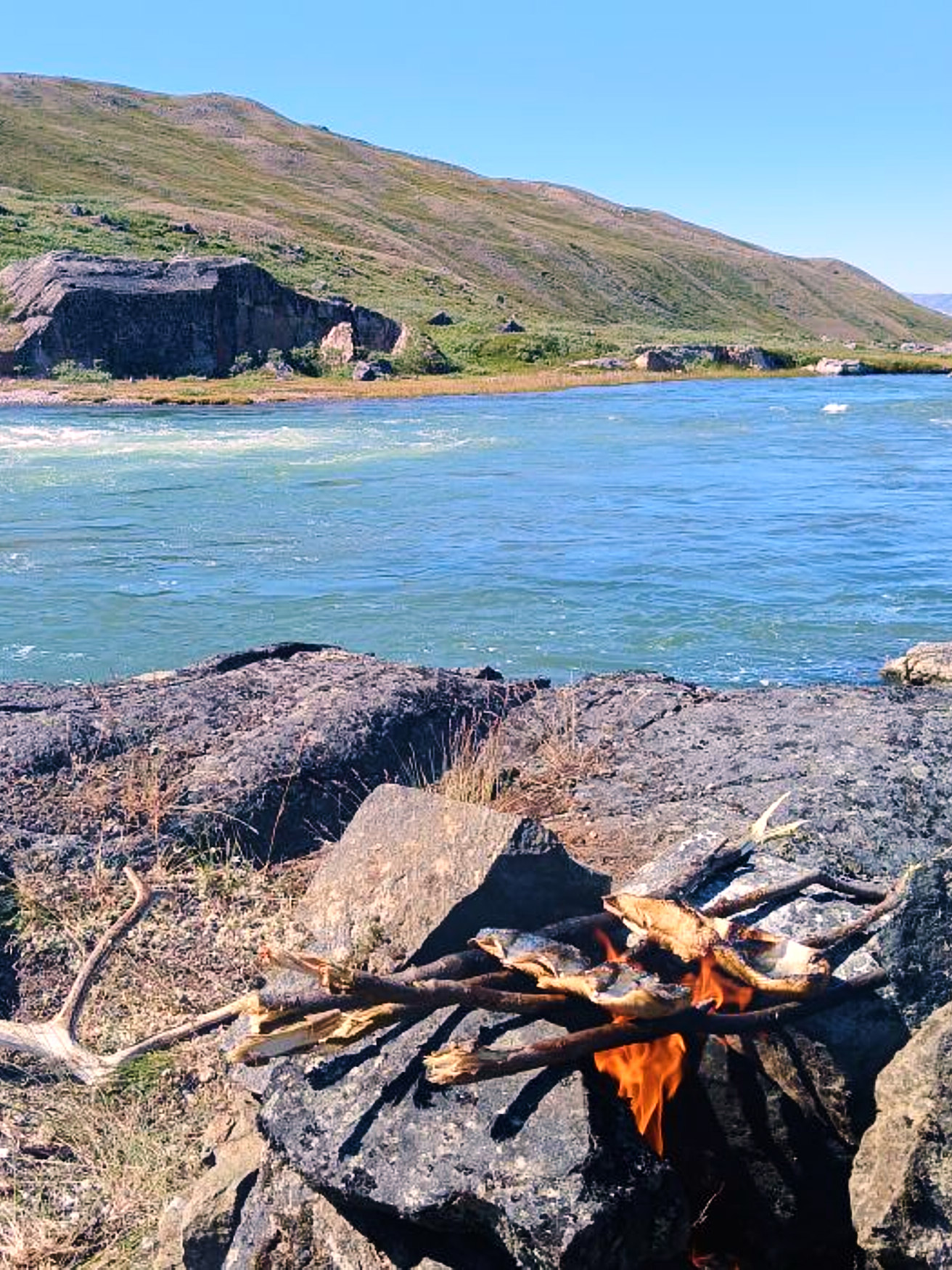 Cooking arctic char on the banks of the Robinson River