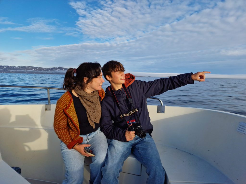 Two tourists on a whale watching tour near Sisimiut