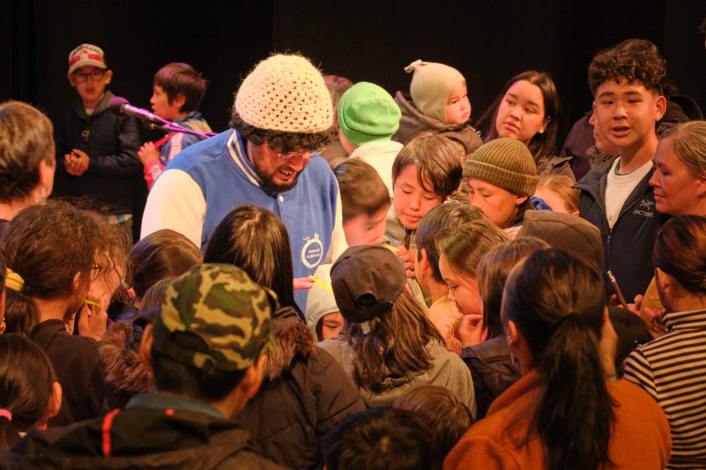 Hinnarik signing autographs for his young fans in Taseralik Culture Centre, Sisimiut